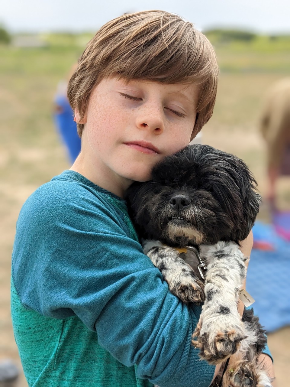 Parker holding a small dog
